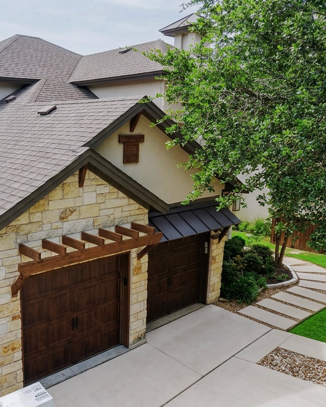 Roof and stone house photographed in Zilker Roofing’s Instagram post